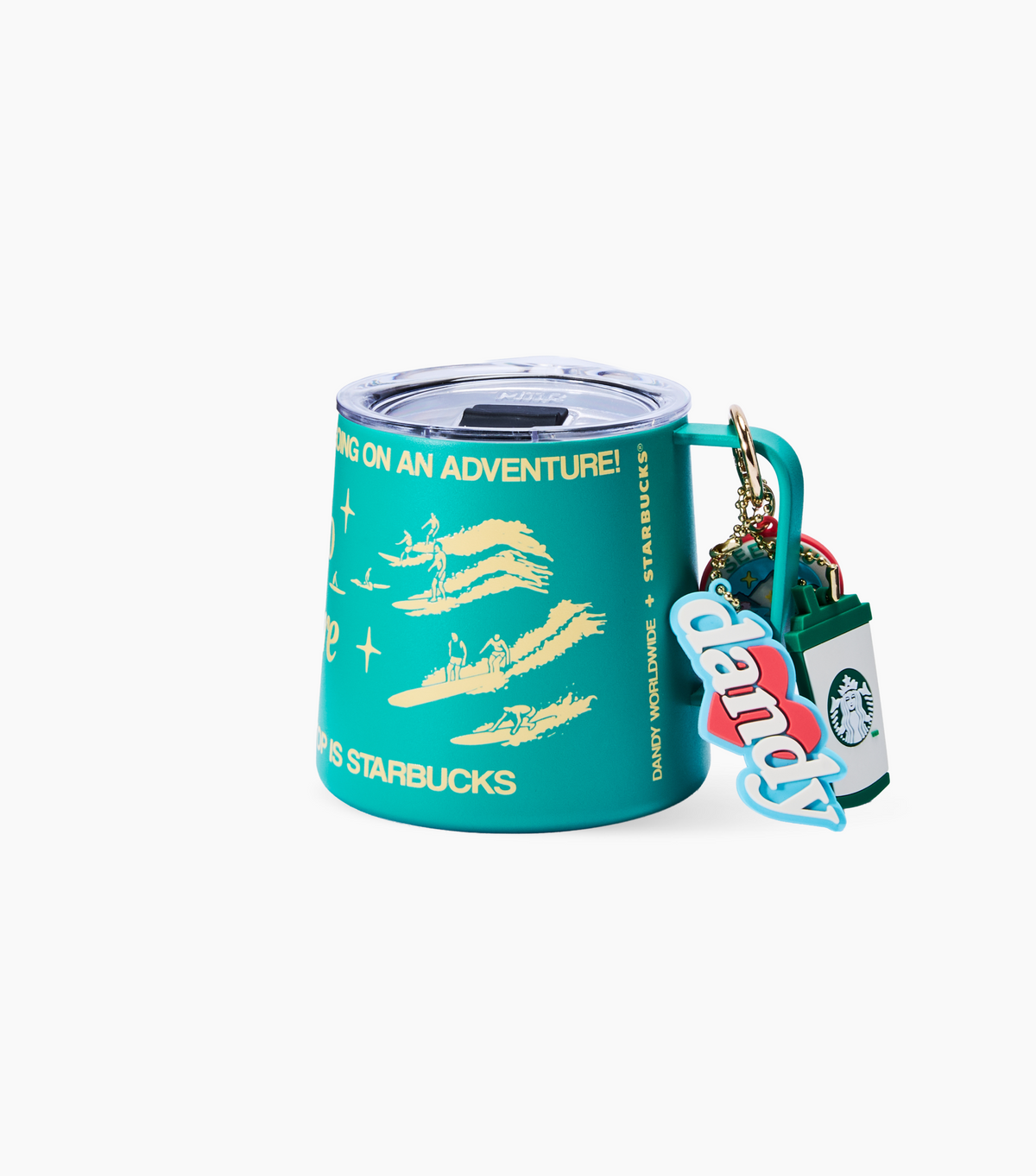 A teal Starbucks travel mug with a matching handle and Starbucks cup keychain, featuring yellow surfer graphics and text, on a plain white background.