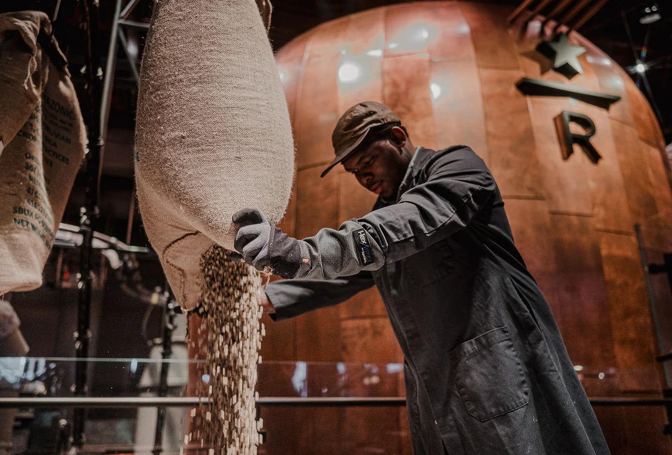 A person working with coffee beans at a Starbucks Reserve Roastery.