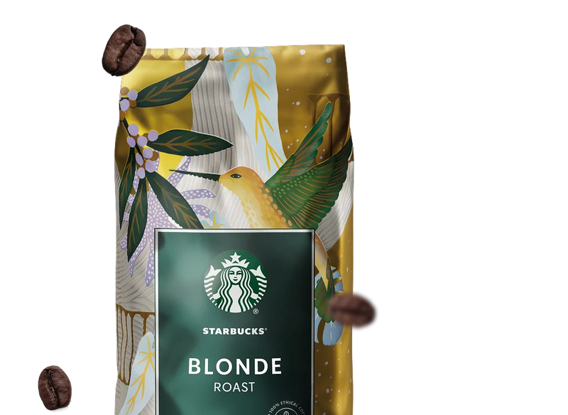 Starbucks Blonde Roast coffee bag with decorative design and coffee beans floating against the background.