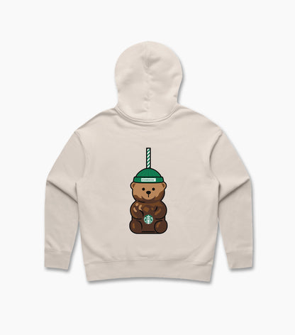Back view of a women’s cream hoodie with a large Bearista bear graphic centered on the back, wearing a green Starbucks beanie with a straw detail.