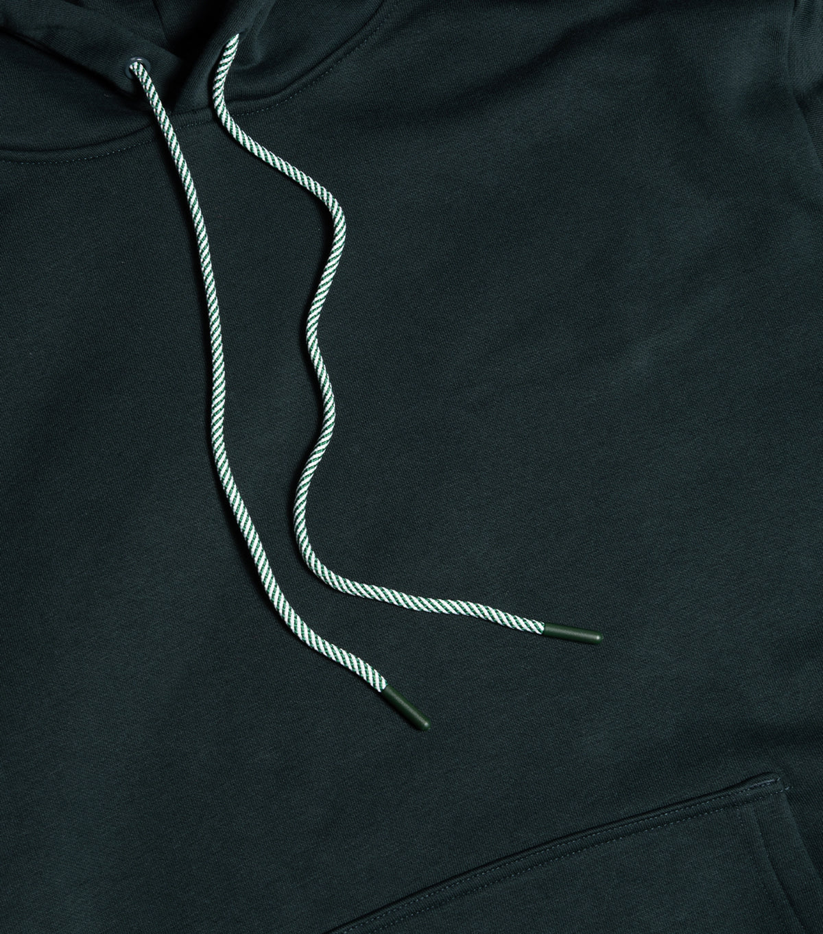 Black hoodie with white drawstrings on a black background