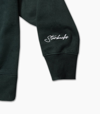 Dark green sweatshirt sleeve with 'Starbucks' logo on a light gray background