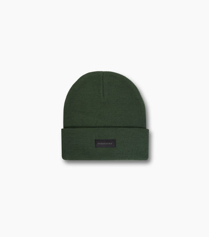 The front of the green Starbucks Knit Beanie with a black Starbucks logo tag, against a white background.