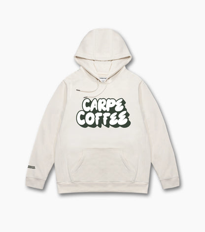 The front of the natural beige Starbucks Carpe Coffee hoodie, featuring printed Carpe Coffee in bold typography across the chest, set against a white background.