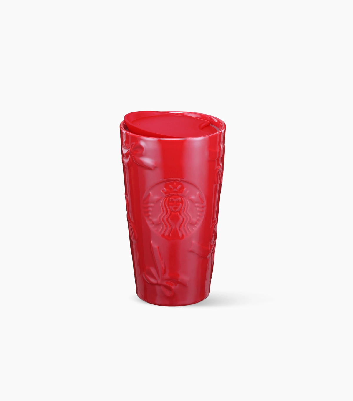A red Starbucks ceramic tumbler with a textured, embossed bow pattern and the embossed Starbucks siren logo on the front, shown on a clean white background.