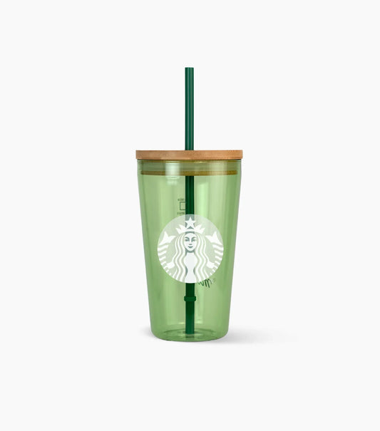 Green Starbucks tumbler with a straw on a white background
