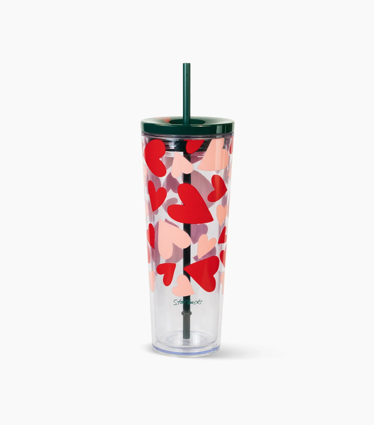 Clear tumbler with red heart pattern and green straw on a white background