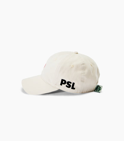 Side view of a light natural colored dad hat with block lettering that says PSL, set against a clean white background.