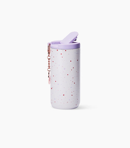 A light lavender insulated tumbler with red speckles, a matching lavender lid, and a rose gold keychain, shown on a clean white background.