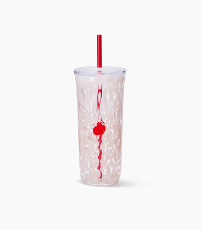 A clear glass Starbucks travel cold cup with a red straw and a red vertical logo, featuring a red PSL pumpkin with a white marble pattern on a light pinkish-beige base, set against a plain white background.