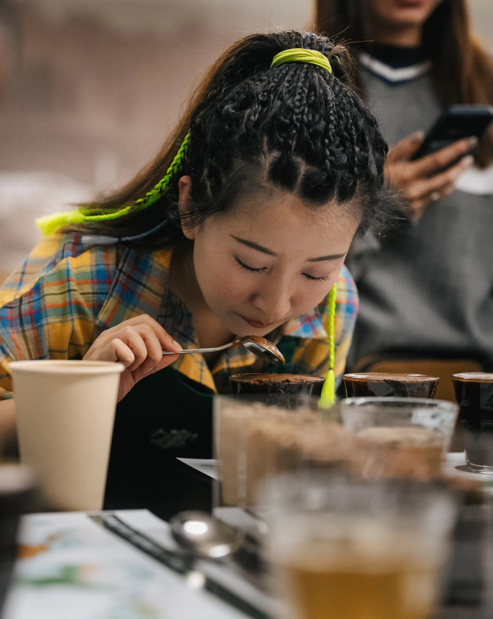 Woman tasting coffee