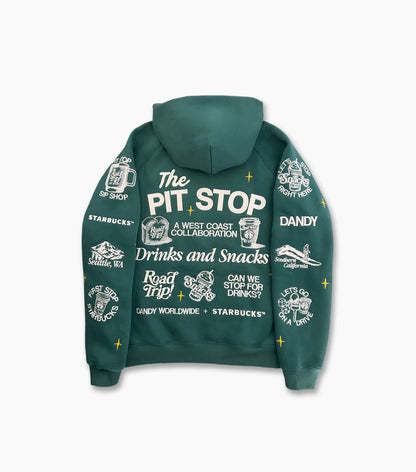 A dark green hoodie shown from the back, featuring white graphic prints and text including 'The PIT STOP', 'Starbucks', 'Dandy', and 'Candy Worldwide'.