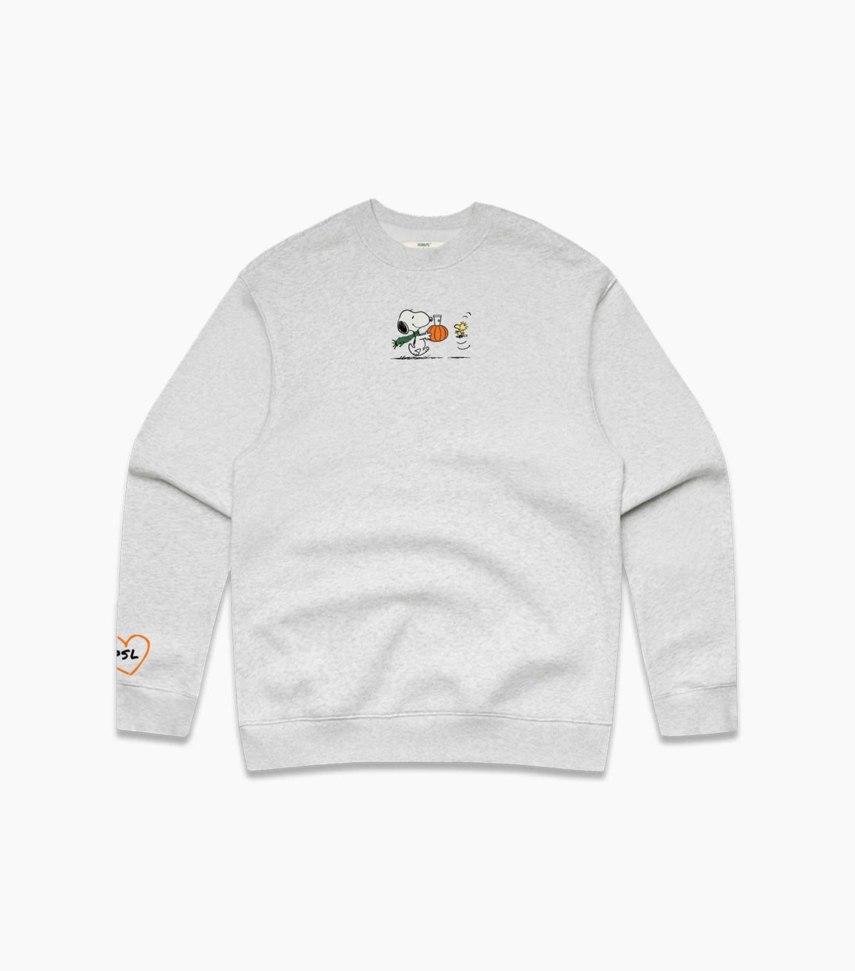 A light heather gray crewneck sweatshirt featuring a small graphic of Snoopy holding a pumpkin on the center chest, with a small orange heart-and-text graphic on the left sleeve.