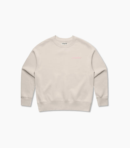 Beige sweatshirt with pink Starbies logo on a white background