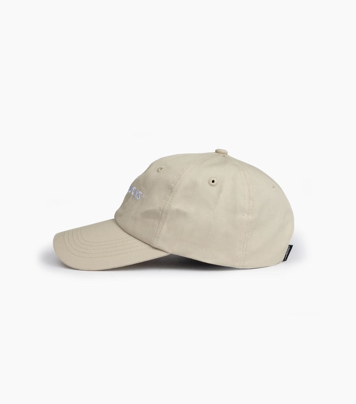 Side view of Starbucks Natural Dad Hat on white background