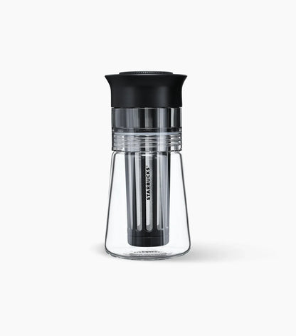 Clear glass Starbucks Cold Brew Coffee Maker with Starbucks brand name logo against a white background.