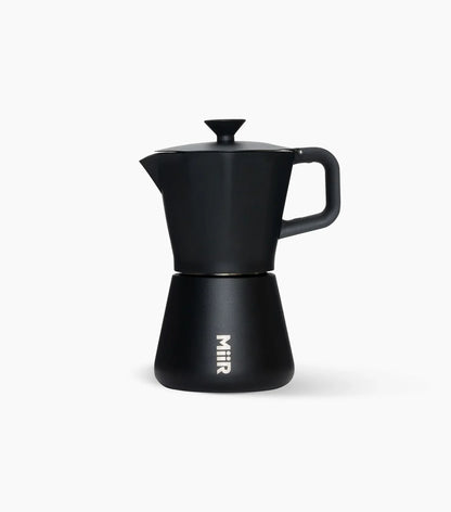 Black Miir Moka Pot Espresso Maker (handle to the right) on a white background.