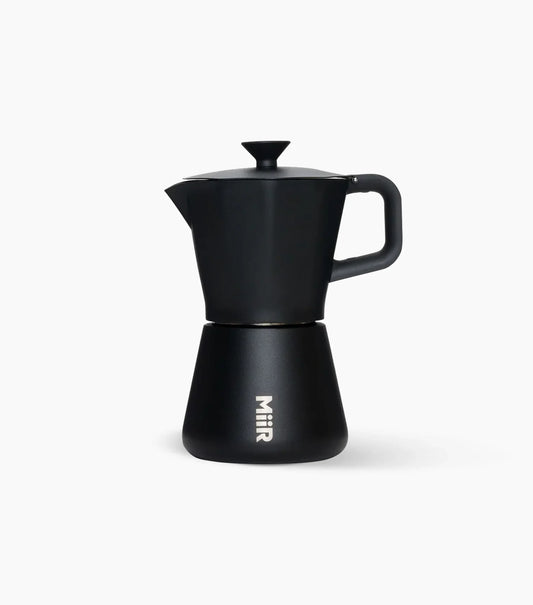 Black Miir Moka Pot Espresso Maker (handle to the right) on a white background.