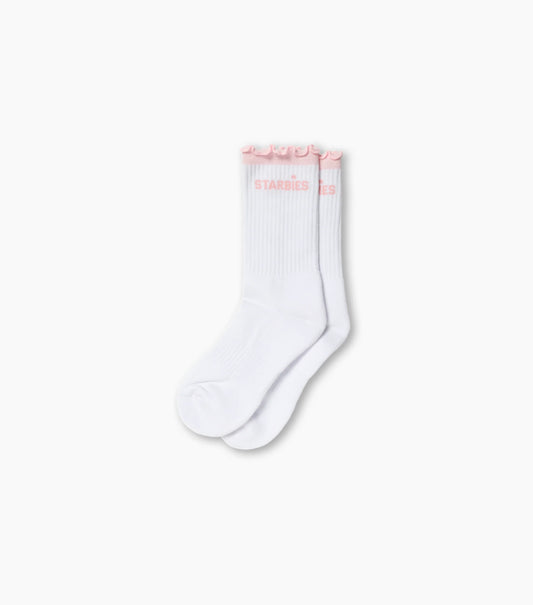 Pair of white ruffle starbies socks on white background