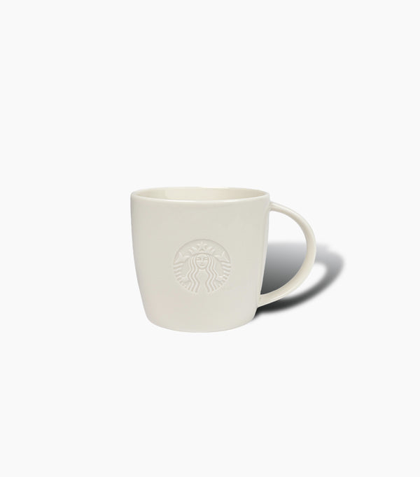 White mug with Starbucks logo on a light gray background