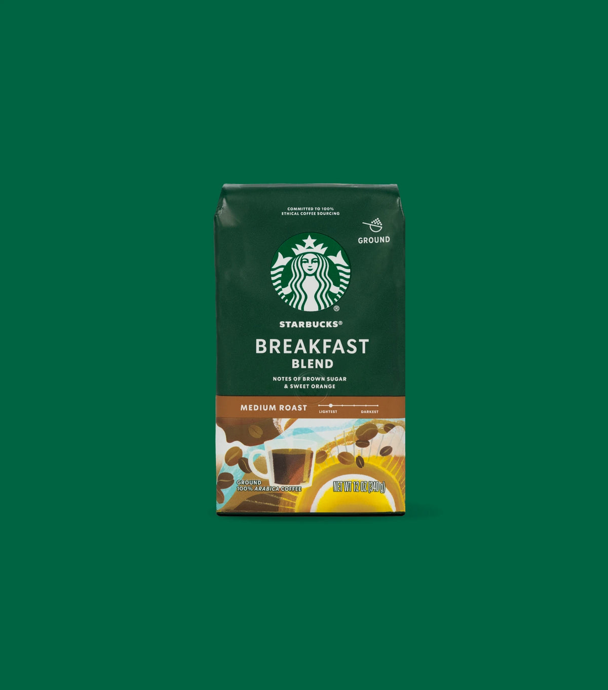 Starbucks Breakfast Blend Medium Roast ground coffee package bag on a green background.