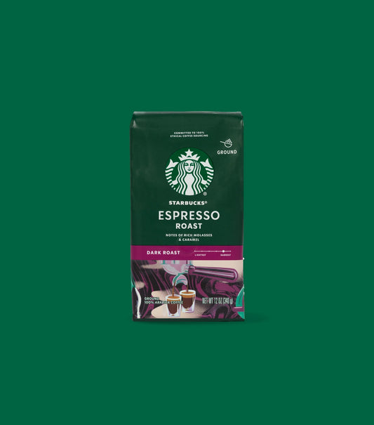 Starbucks Espresso Roast Dark Roast coffee package on a light green background.
