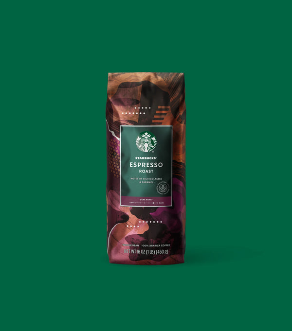 Starbucks Espresso Roast coffee bag on a light green background.