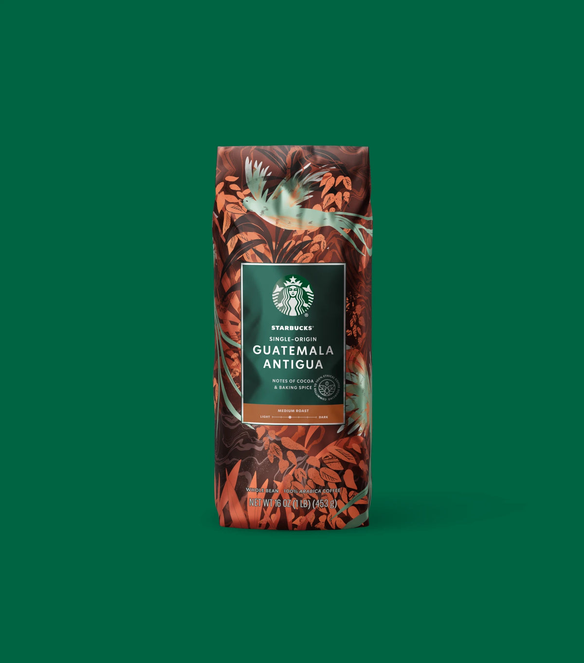 Starbucks Single-Origin Guatemala Antigua coffee bag on a green background.