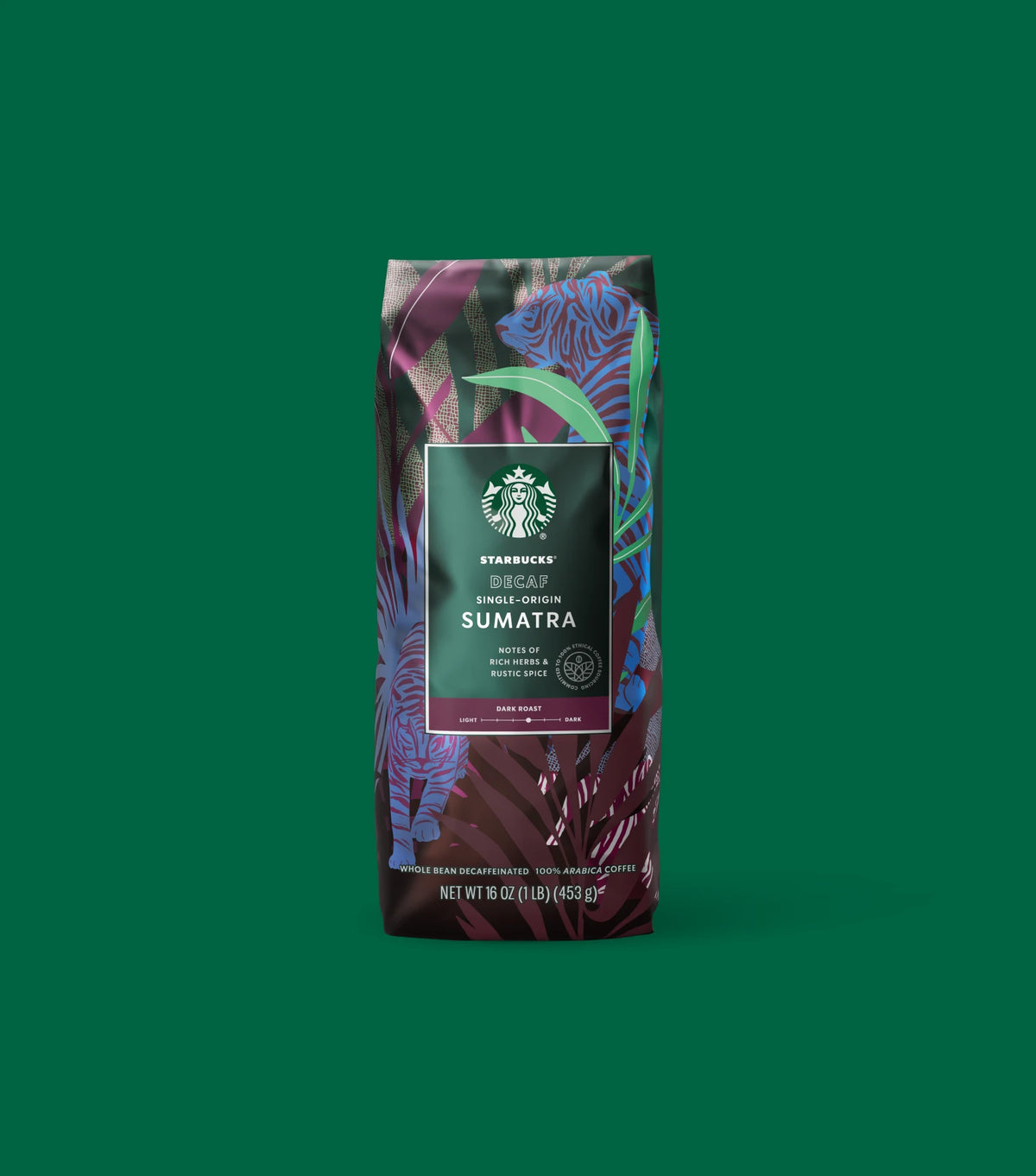 Starbucks Decaf Single-Origin Sumatra coffee bag on a green background.