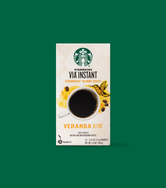 Starbucks VIA Instant Blond Roast Veranda Blend Coffee box packaging on a light green background.
