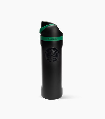 A matte black Starbucks travel tumbler with a green accent band and matching green lid detail, shown on a clean white background.