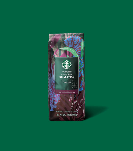 Starbucks Single-Origin Sumatra coffee bag on a green background.