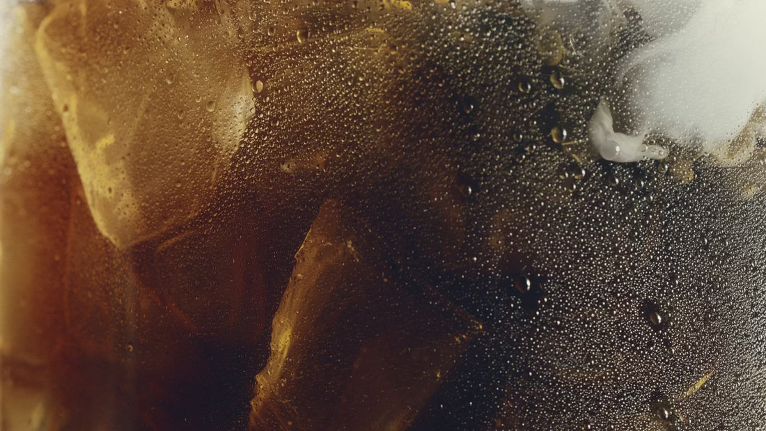 Video thumbnail of a close-up shot of an coffee drink with ice cubes, water condensation and milk.