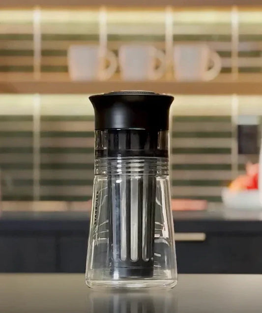 Starbucks Cold Brewer sitting on top of a surface against a kitchen background.