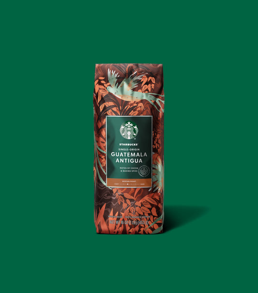 Starbucks Single-Origin Guatemala Antigua coffee bag on a green background.